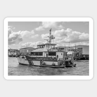 Crew transfer vessel motoring towards the sea in Great Yarmouth, Norfolk Sticker